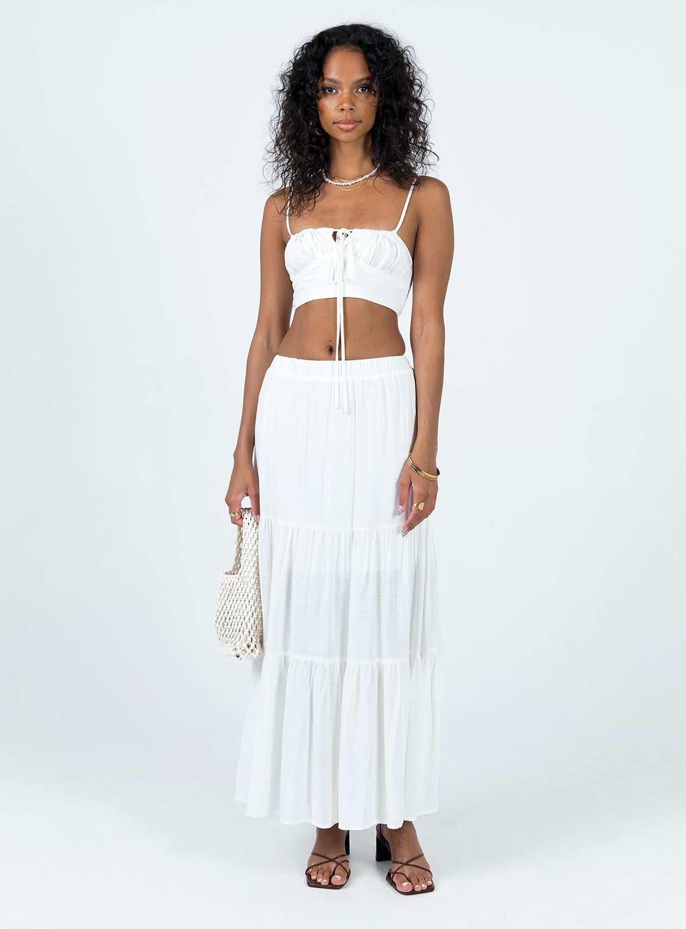 Two piece set Crop top Adjustable shoulder straps Adjustable tie fastening at front Shirred back Maxi skirt Elasticated waistband Tiered skirt