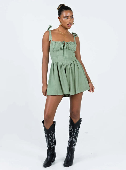 Romper Adjustable shoulder straps with tie fastening  Ruched bust Invisible zip fastening at back Slight ruching at waist