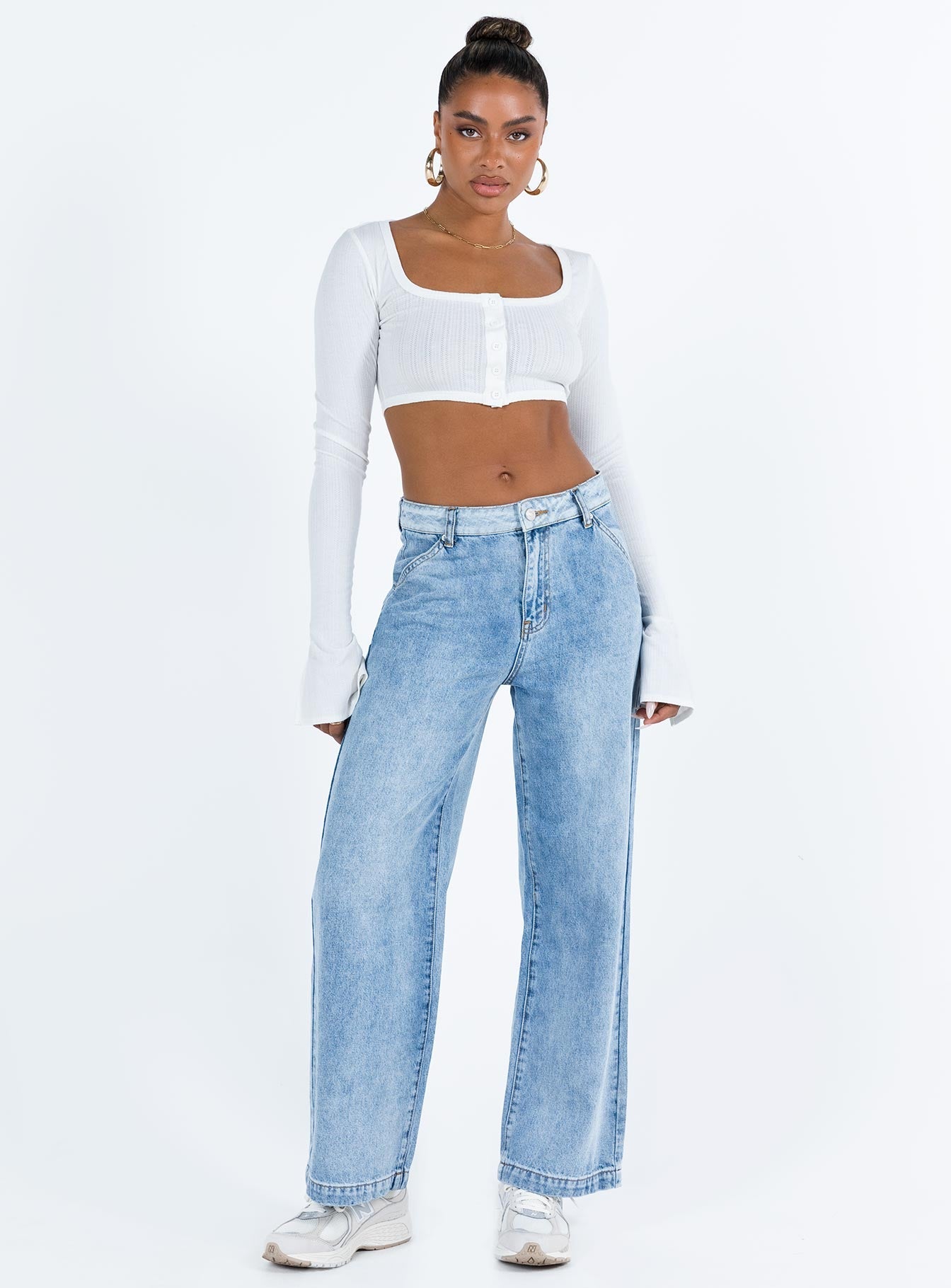 White long sleeve top Thin knit material Cropped design Scoop neck Front button fastening Flared sleeves Good Stretch Unlined 