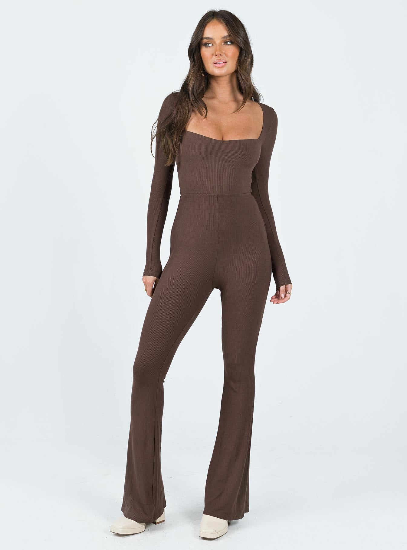 Long sleeve jumpsuit Ribbed material Square neckline Cut out at back with tie fastening Good stretch Partially lined