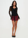 Black Long sleeve top Lace material, v neckline, tie fasting at front, frill detail throughout