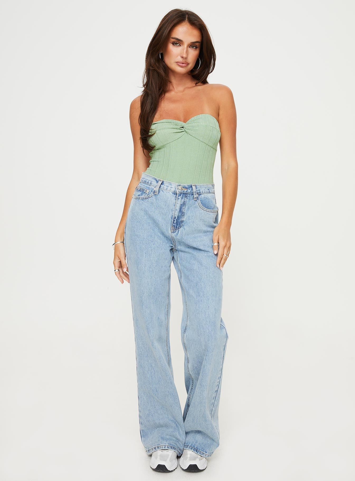 Strapless bodysuit Inner silicone strip at bust, twist detail, high cut leg, cheeky style bottom, press clip fastening Good stretch, fully lined