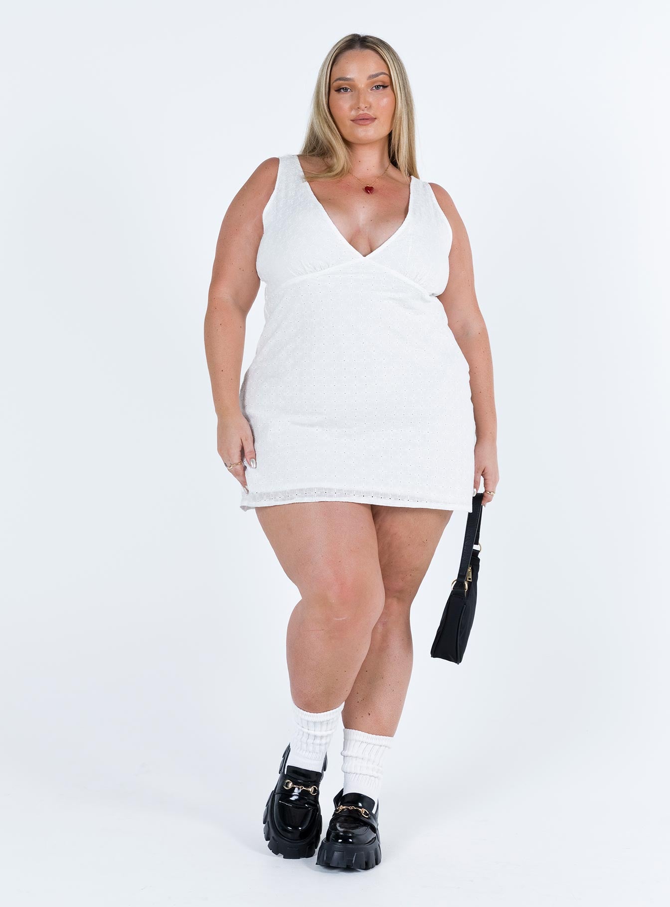 White mini dress Broderie anglaise material V neck Singe waist tie at back Invisible zip fastening at side  Wide shoulder straps A line fit