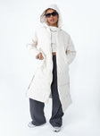 Longline puffer jacket Drawstring hood  Zip front fastening  Twin hip pockets  Press button fastening down sides  Fully lined 