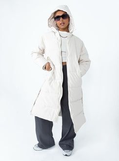 Longline puffer jacket Drawstring hood  Zip front fastening  Twin hip pockets  Press button fastening down sides  Fully lined 