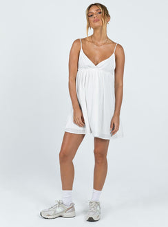 Mini dress Muslin look material Adjustable shoulder straps   Plunging neckline Ruffle detail  Elasticated back