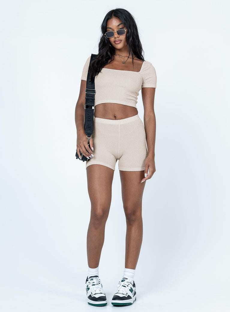 Beige crop top 90% nylon 10% spandex  Soft textured material  Can be worn on or off the shoulder  Good stretch  Unlined 