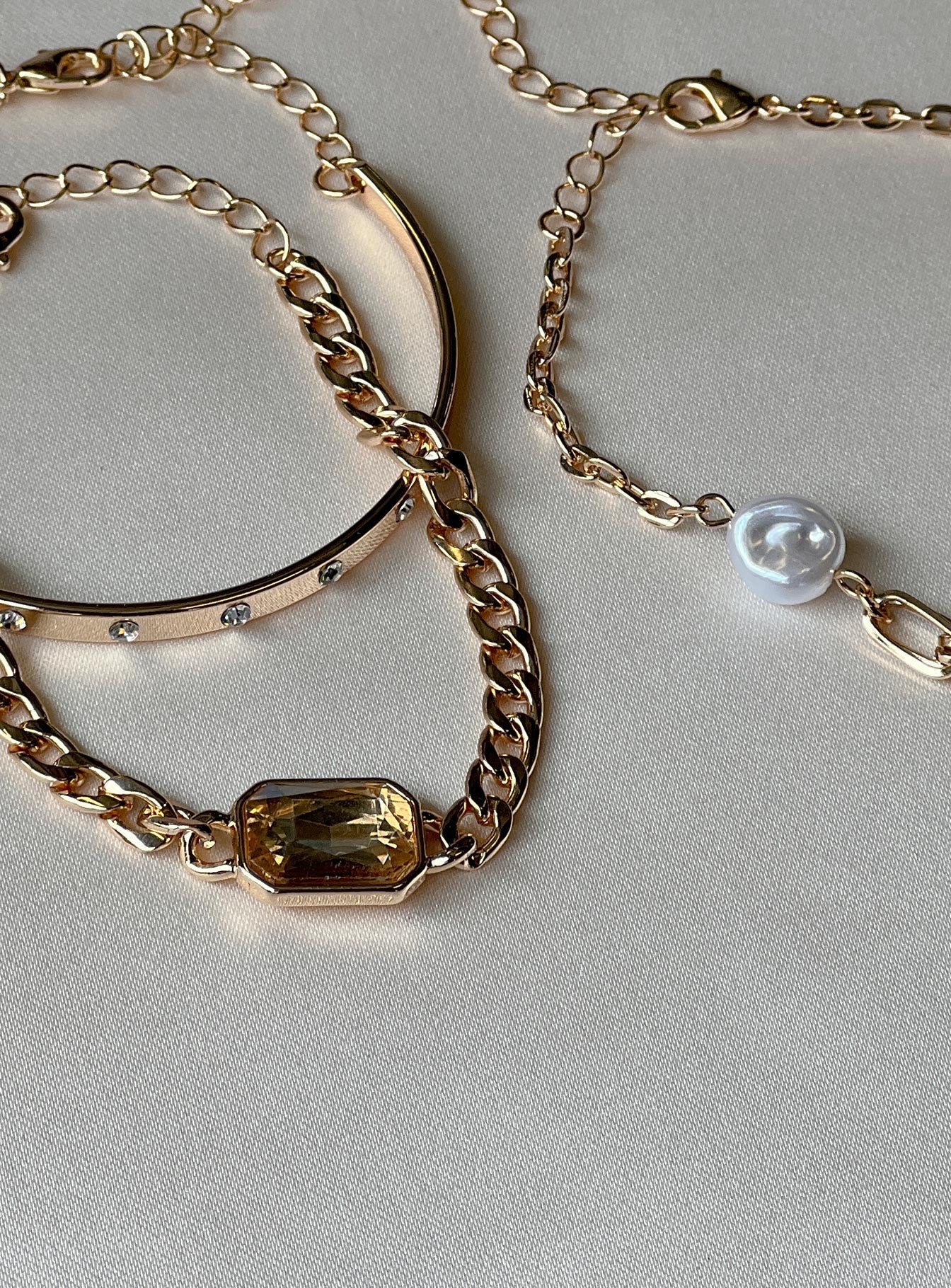 Bracelet Pack of three One bangle style Pearl & diamante detail Lobster clasp fastening Gold-toned