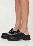 Faux patent leather loafers Slip-on design, chunky treaded sole, rounded toe 