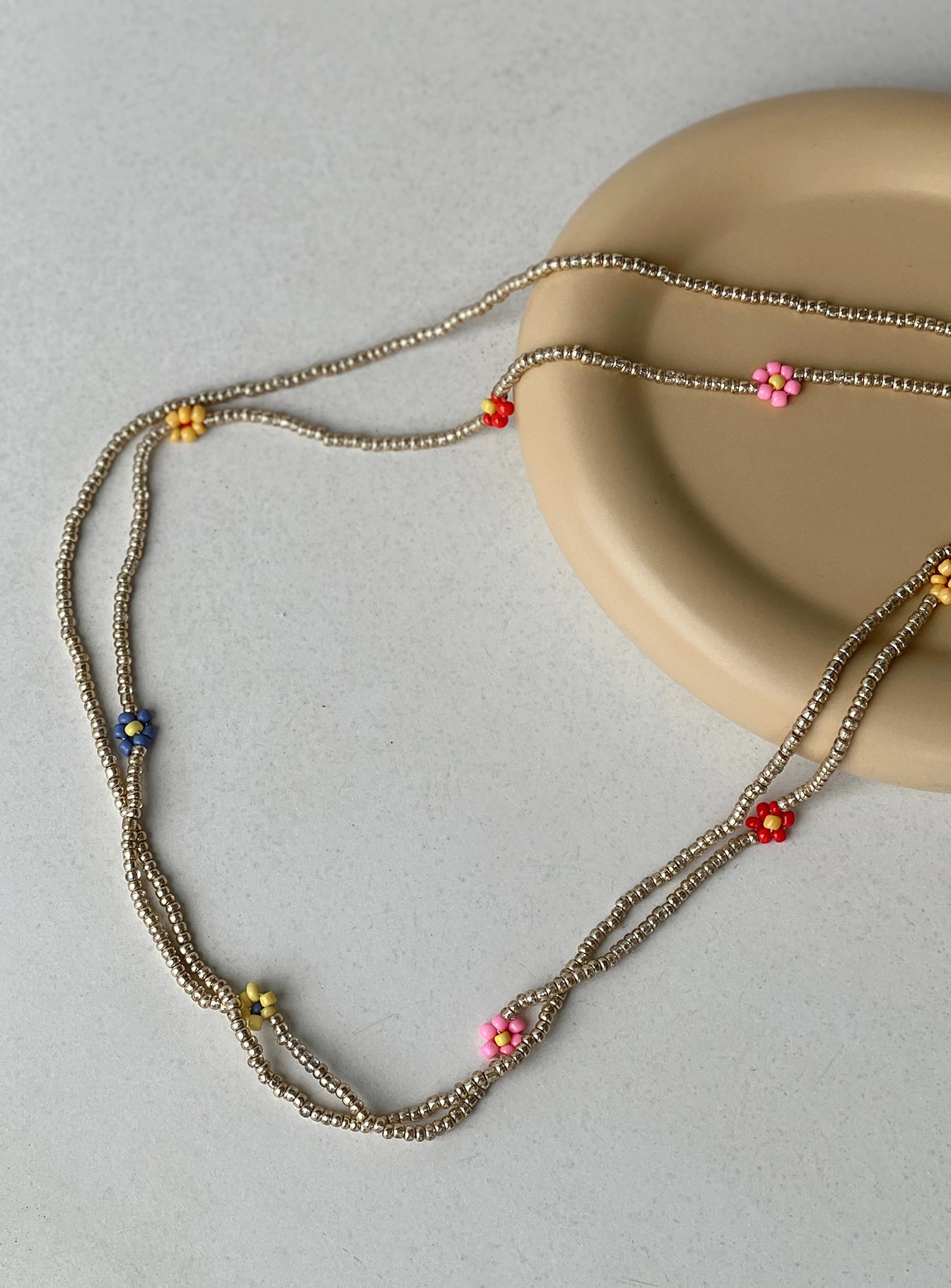 Waist belt Beaded design Coloured flower beads Double layer Gold toned hardware Lobster clasp fastening Adjustable length