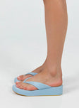 Platform sandals Platform base Thin flip-flop style upper Padded footbed Rounded toe