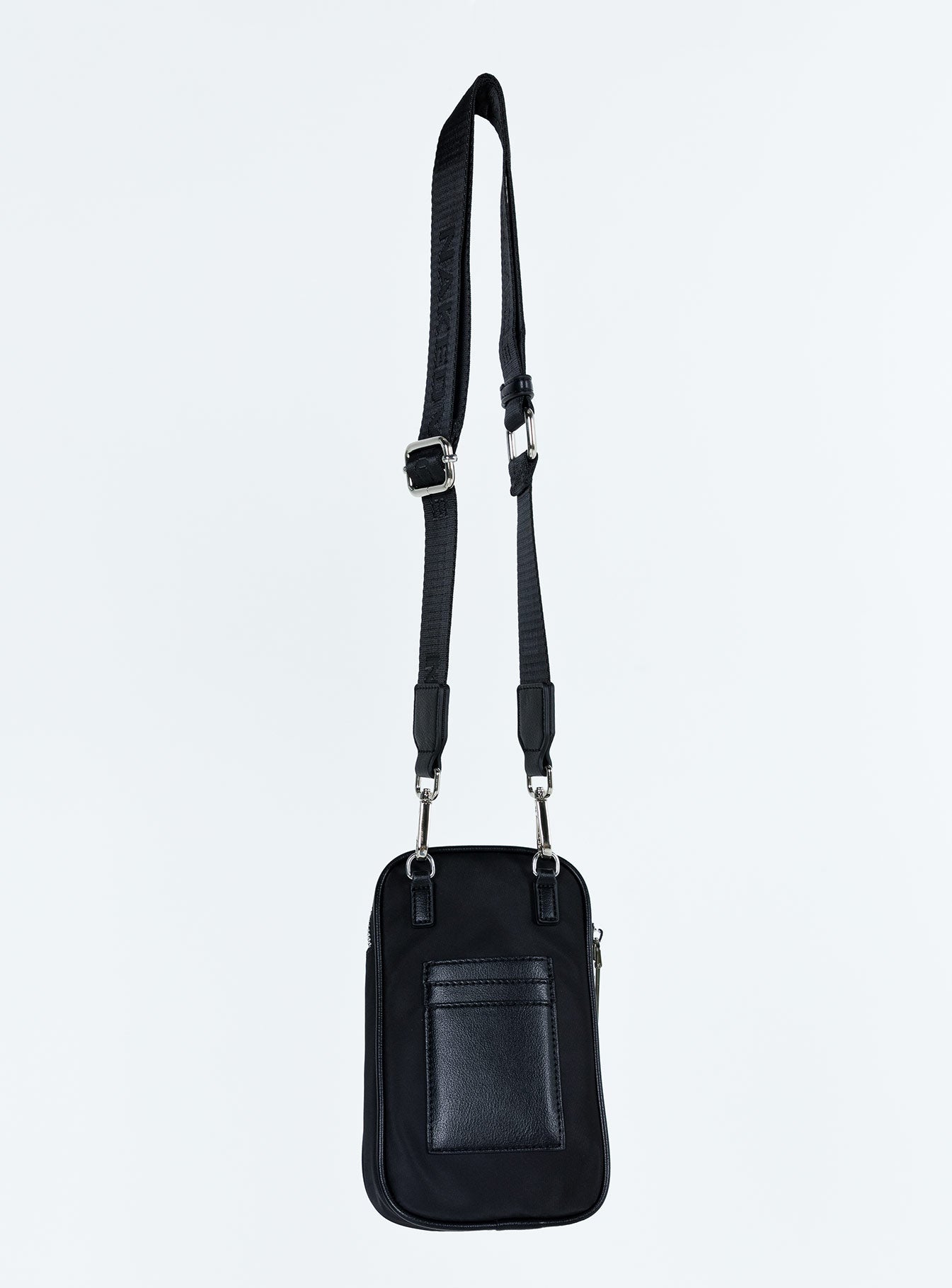 Crossbody bag Nylon material Silver toned hardware Zip fastening Removable and adjustable crossbody strap Card slip at back