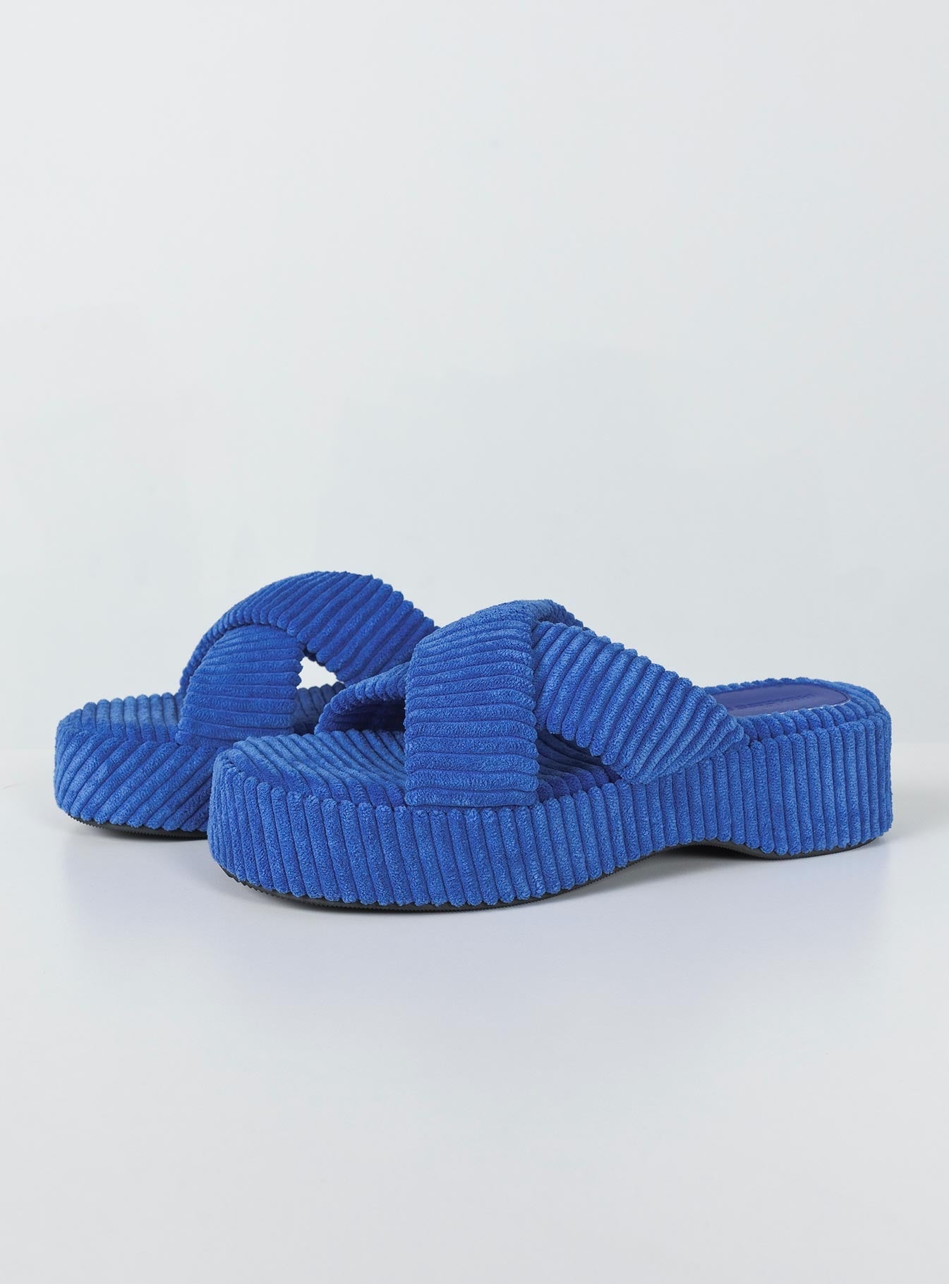 Sandals Cord material  Cross strap upper  Platform base  Rounded toe 