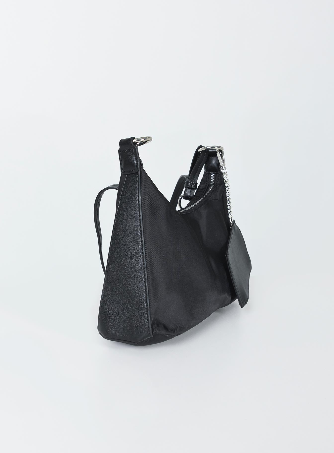 Crossbody bag  Princess Polly Exclusive Nylon & faux leather material  Silver-toned hardware  Chain shoulder strap  Removable & adjustable crossbody strap  Removable coin purse  Zip fastening Flat base   Fully lined 