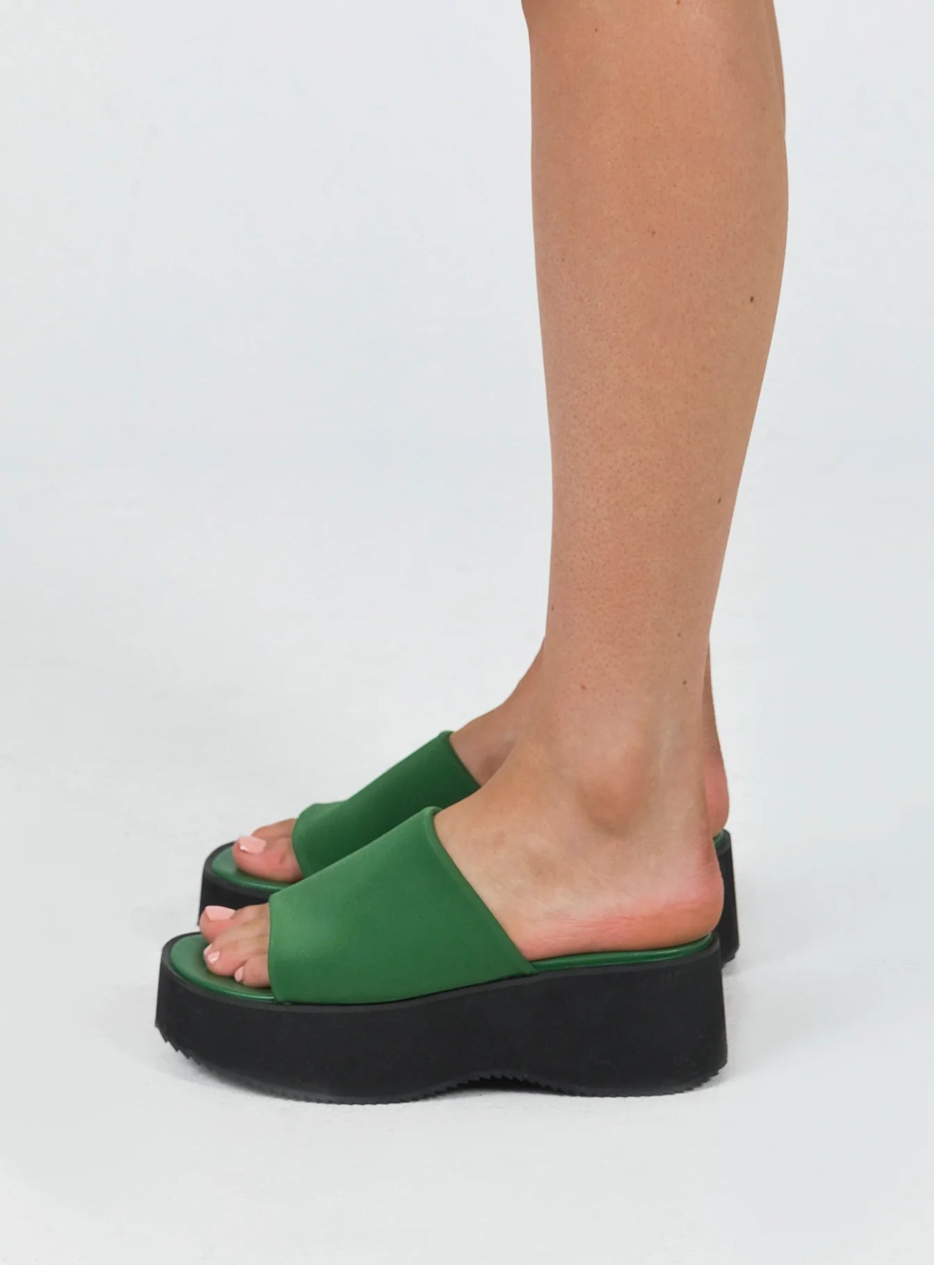 Sandals Single wide upper  Platform base  Rounded toe 