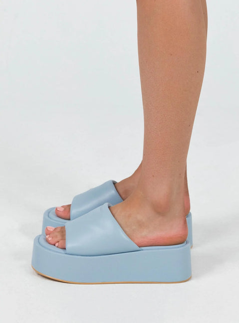 Sandals Faux leather  Wide upper  Slit at side for movement Square toe  Padded footbed  Platform base 