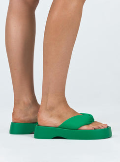 Sandals  Flip-flop style upper  Rounded toe  Padded foot  Platform base 