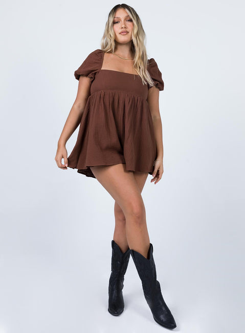 Romper Muslin material Square neckline  Elasticated puff sleeves Shirred back panel Invisible zip fastening at back  Relaxed leg 