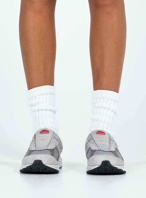 Faux suede sneakers, slip-on style Padded footbed, mesh netting detail, treaded sole