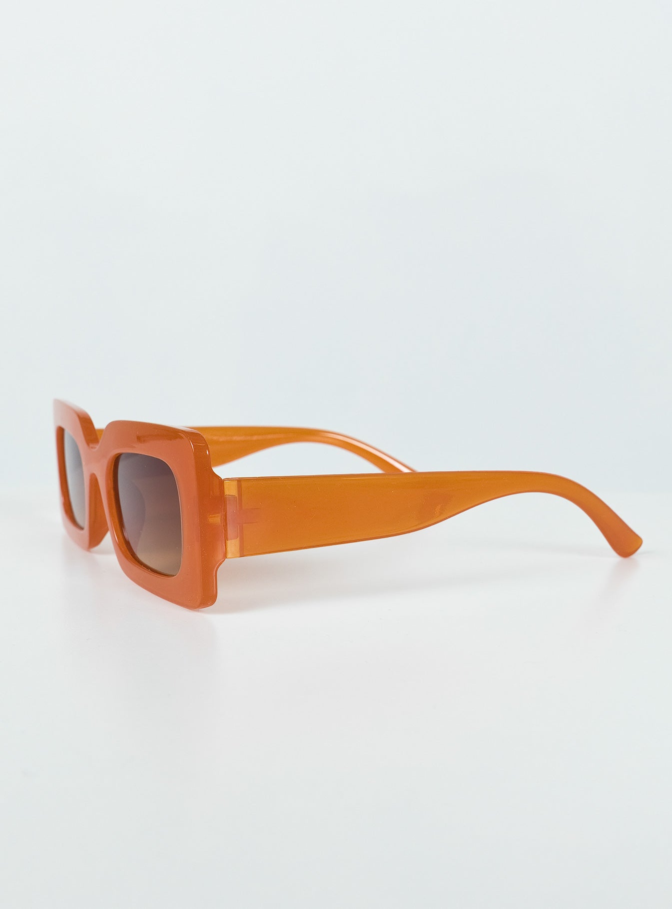 Sunglasses Vintage style frame Orange tinted lenses Wide arm Moulded nose bridge Lightweight
