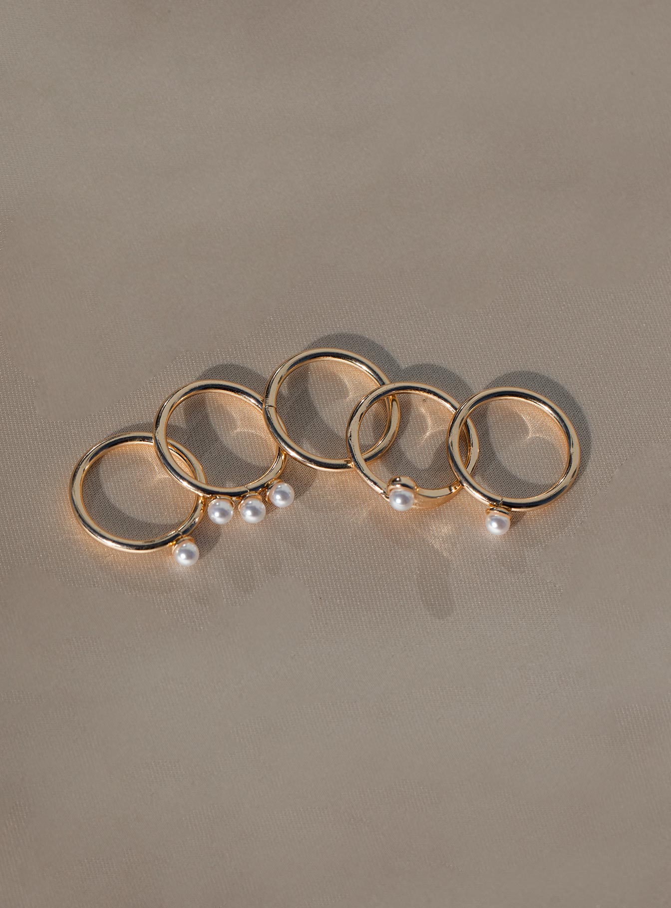 Rings Pack of five Gold-toned band  Pearl charm 