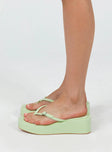 Sandals Flip-flop style upper Silver-toned buckle detail Platform base Square toe  Padded footbed 