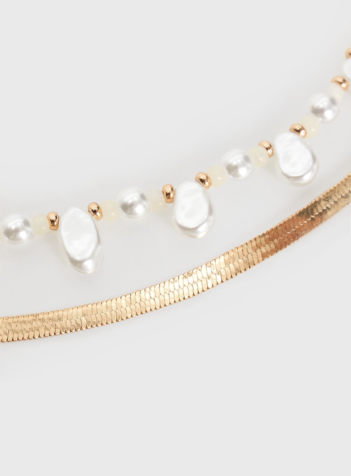 Gold-toned chain belt Two separate chains, pearl detail, lobster clasp fastening