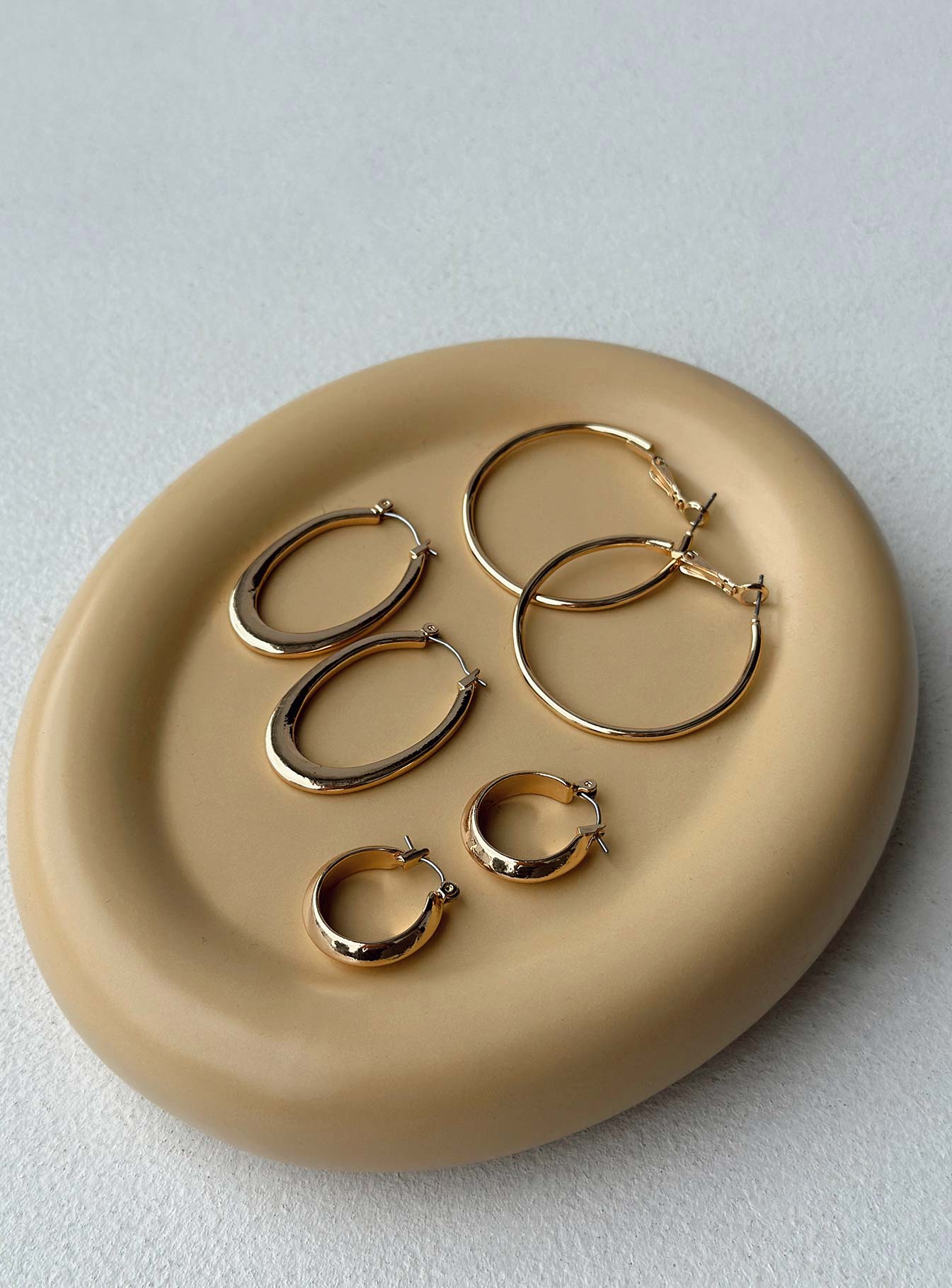 Earrings Pack of three Gold-toned Hoop fastening