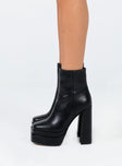Black boots Faux leather material Zip fastening at side Square toe Platform base Block heel