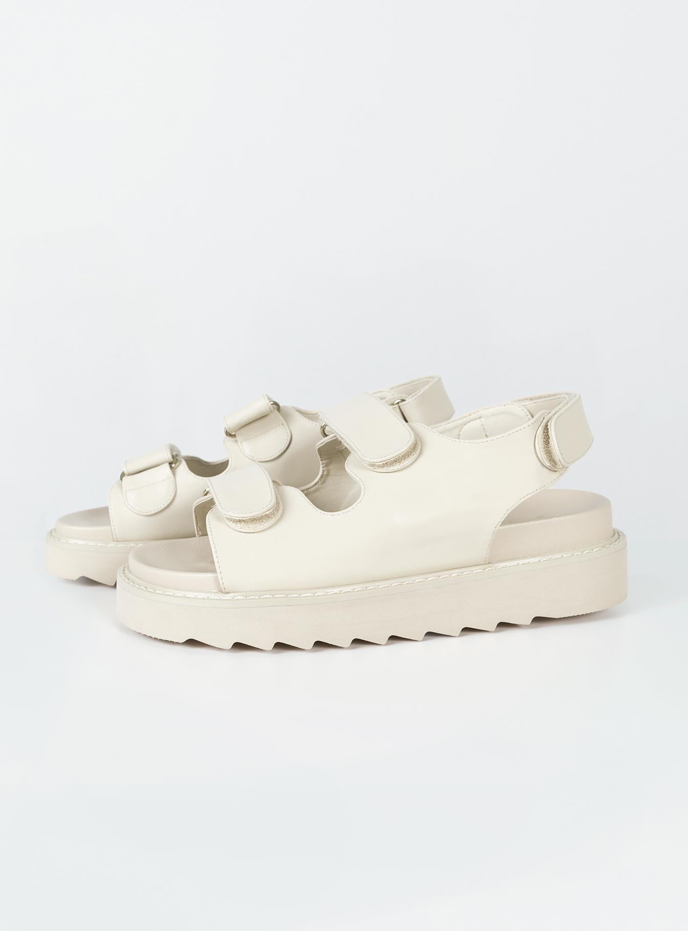 Sandals Faux leather material Twin velcro upper Ankle strap with velcro fastening Chunky treaded sole Padded footbed