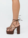 Heels Faux leather material  Strappy upper  Ankle tie fastening  Platform base  Block heel  Square toe 