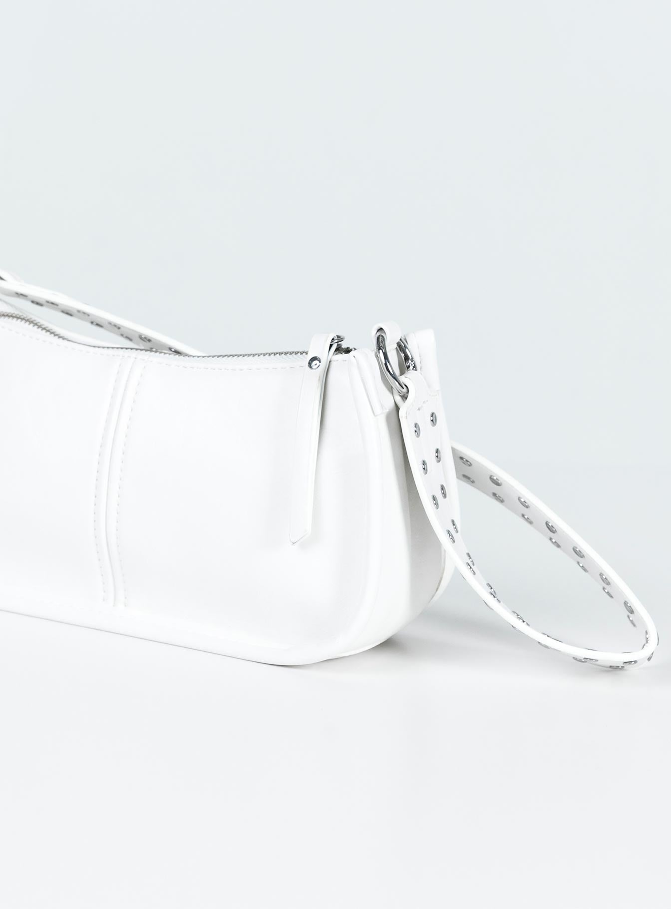 Bag Faux leather material Zip fastening Adjustable & removable cross-body strap Removable fixed shoulder strap Internal pocket Silver-toned hardware Flat base