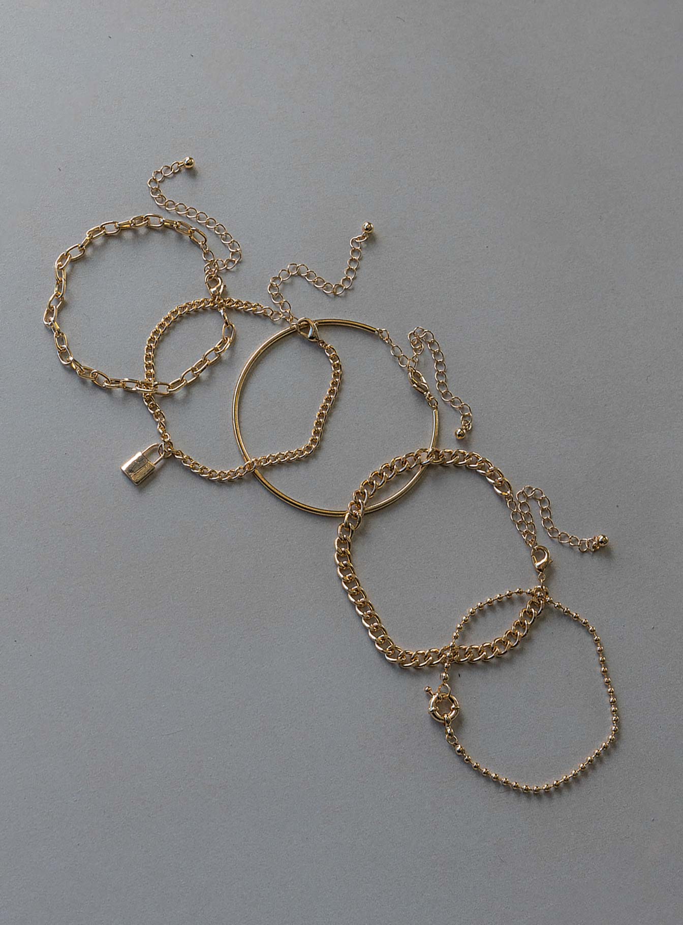 Bracelet Pack of five  These can be worn separately Chain styles  Solid band style  Locket pendant  Lobster clasp fastening 