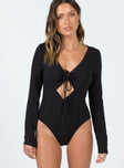 Long sleeve bodysuit Ribbed material  Wide neckline  Tie front fastening  Cheeky cut bottom  Press clip fastening at base 