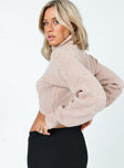 Beige jumper Knit material Roll turtle neck Cross over front Fitted cuffs