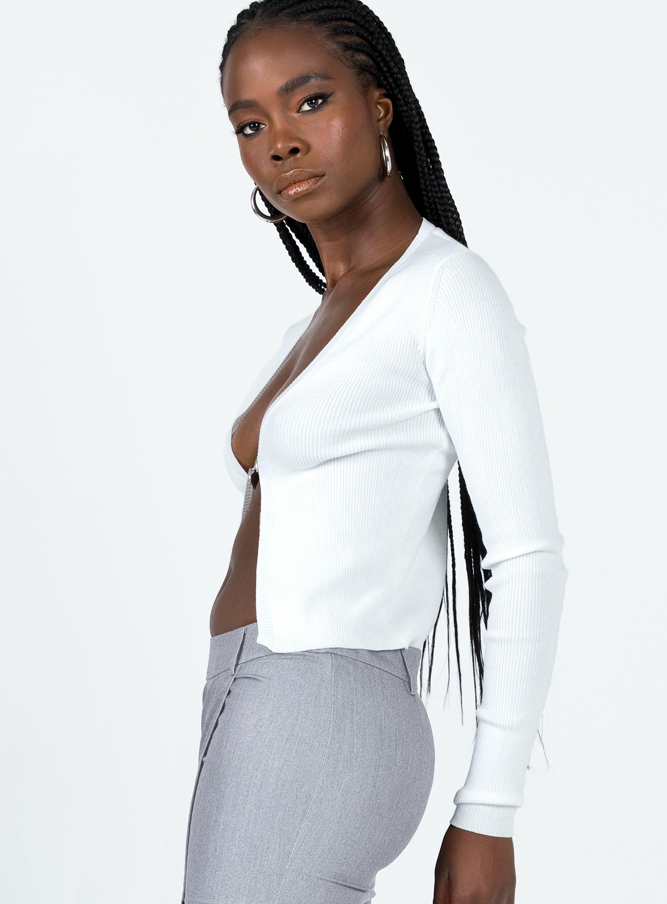 Long sleeve top Ribbed material Open front design Plunging neckline Fixed chain link at bust Good stretch