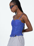 Blue top Lace material Adjustable shoulder straps Wired cups Zip fastening at back Boning through front Frill hemline