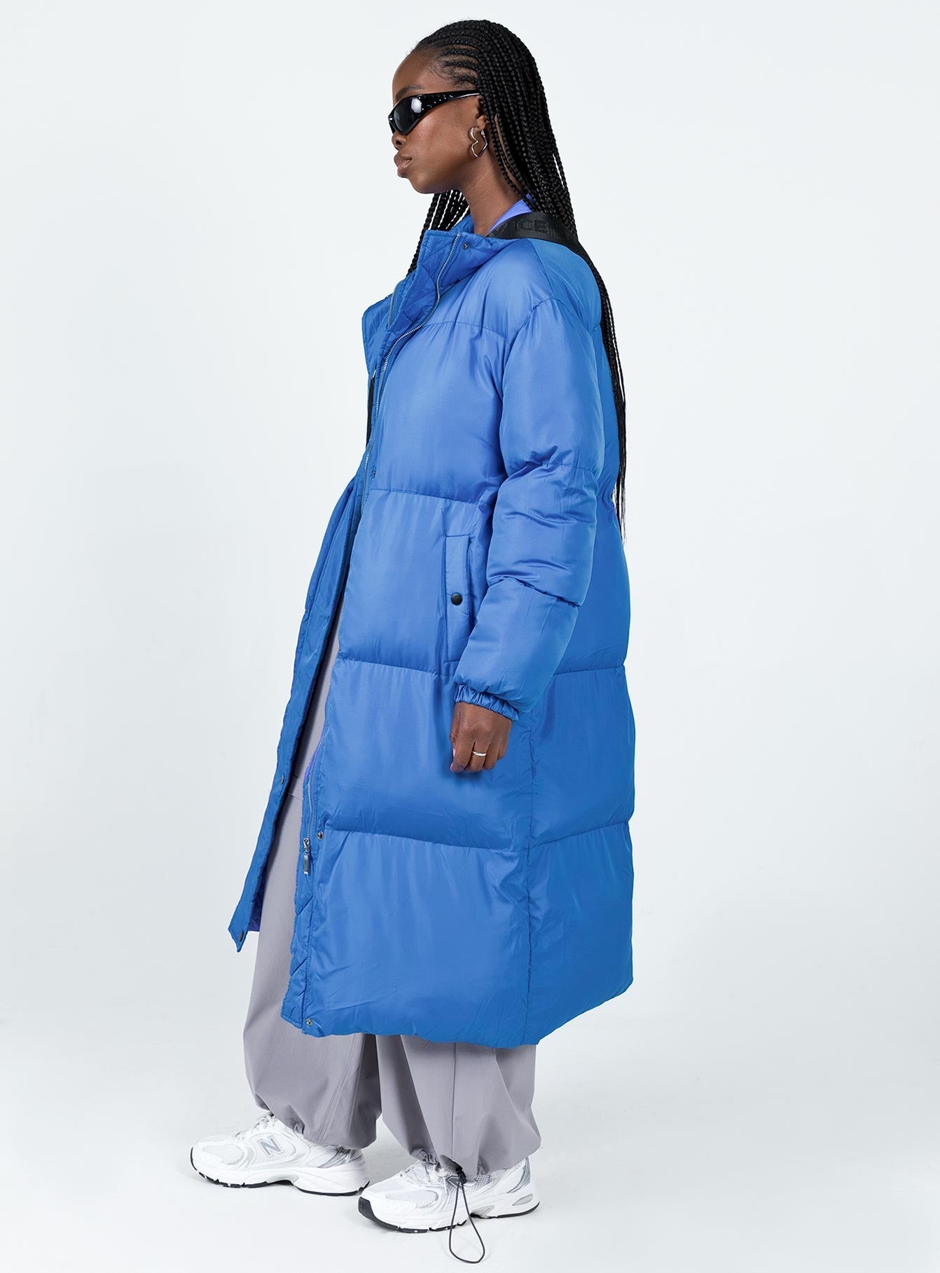 Longline puffer jacket High neck  Zip & press button fastening  Twin hip pockets 
