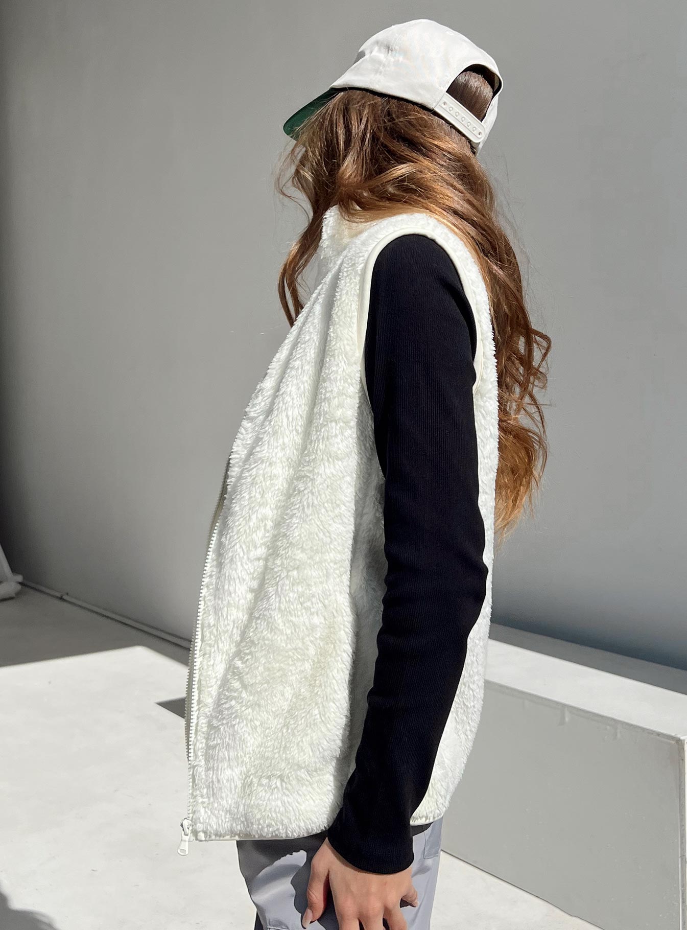 Vest  100% recycled fibres  Faux fur material  Mock neck  Zip front fastening  Twin hip pockets  Non-stretch Fully lined 