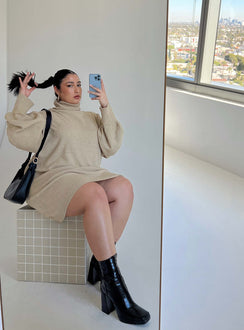 Mini dress Soft knit material High rolled neckline Ribbed hem & cuffs Drop shoulder Unlined