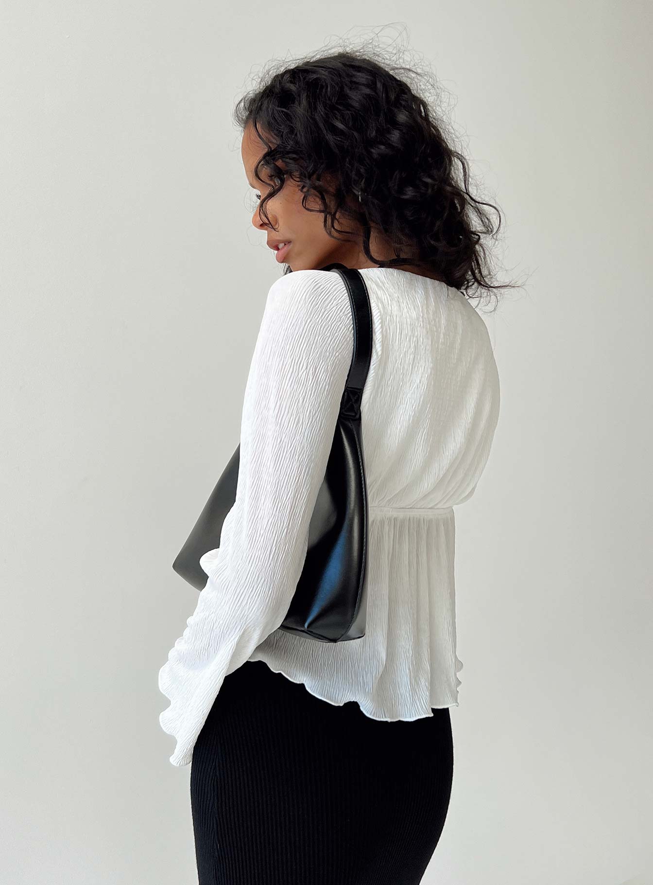 Long sleeve top Crinkle material V neckline Tie fastening at bust Good stretch Partially lined