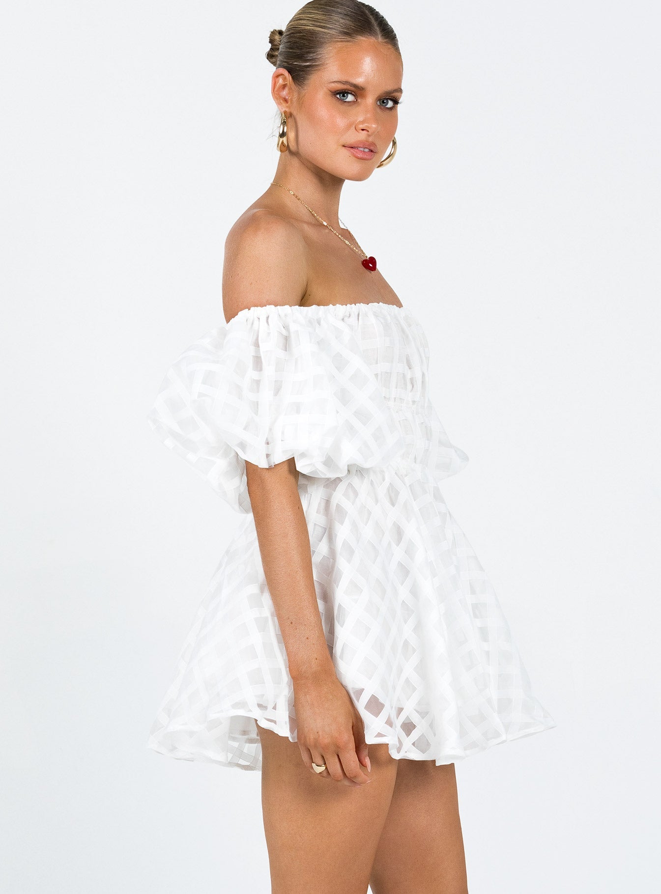 White mini dress Sheer material Off the shoulder design Puff sleeve Elasticated bands at waist