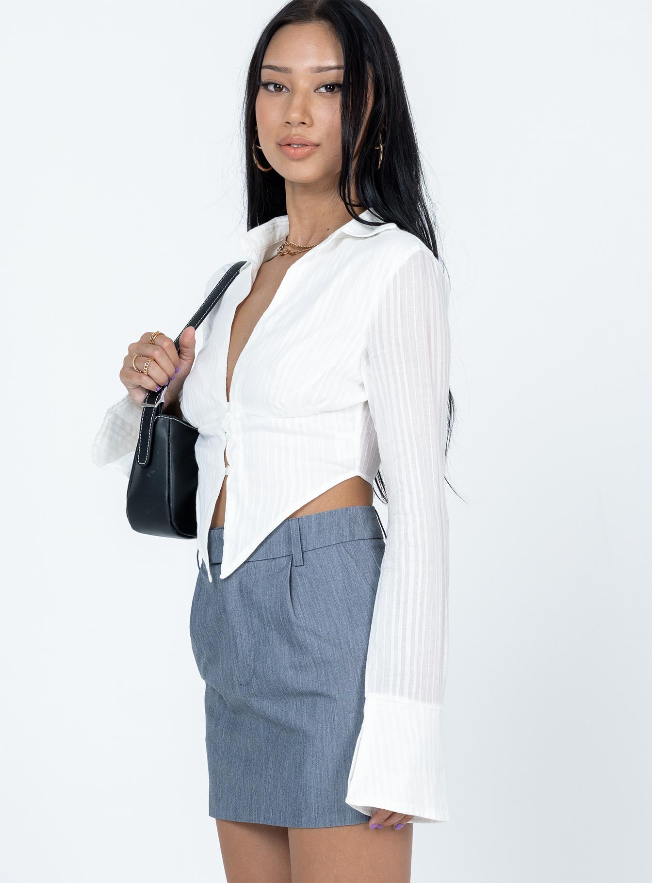 Long sleeve top Sheer material  Classic collar  V neckline  Single bust fastening at bust  Pointed hem  Flared cuffs