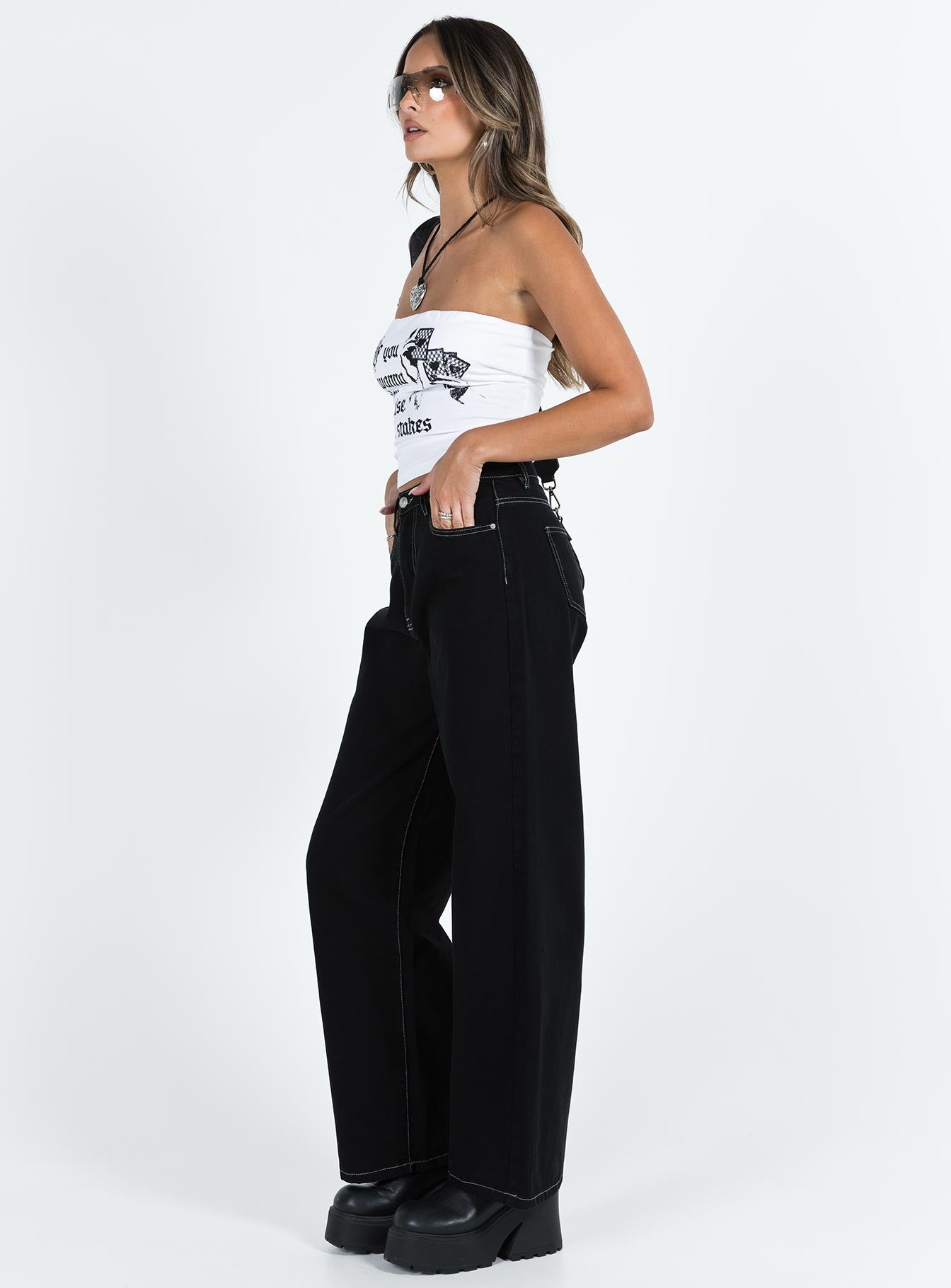 Jeans High rise Black denim Belt looped waist Zip and button fastening Classic five pocket design Branded patch at back Wide leg