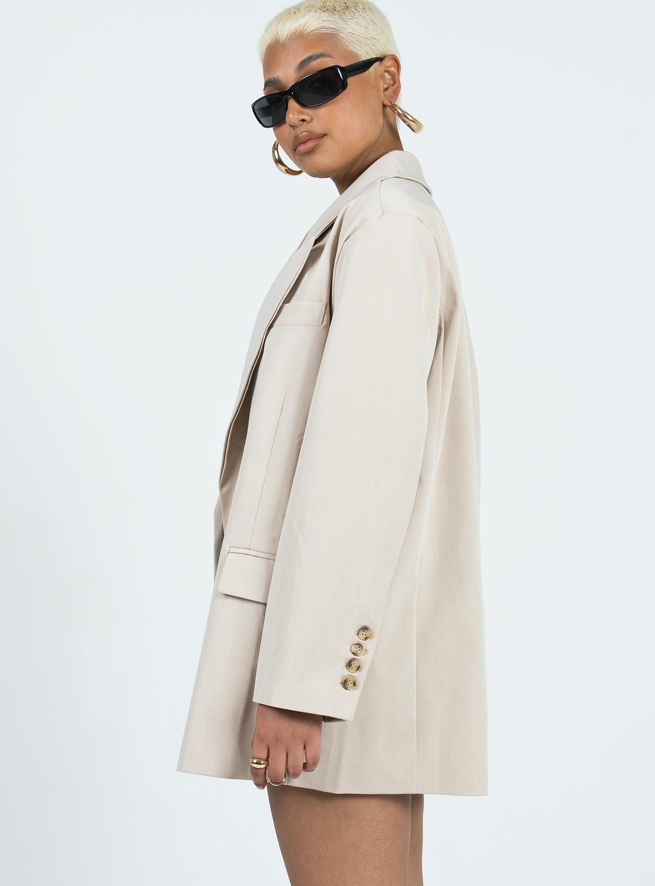 Oversized blazer Spare button included Lapel collar  Button front fastening  Twin hip pockets  Faux chest pocket  Four-button cuffs  Satin lined 