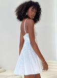 White mini dress Sheer mesh material Adjustable shoulder straps Lace bust V neckline Asymmetrical hem