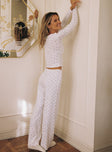 Matching two piece set Long sleeve top, v neckline, frill trimming Mid rise pants, bow detail, straight leg