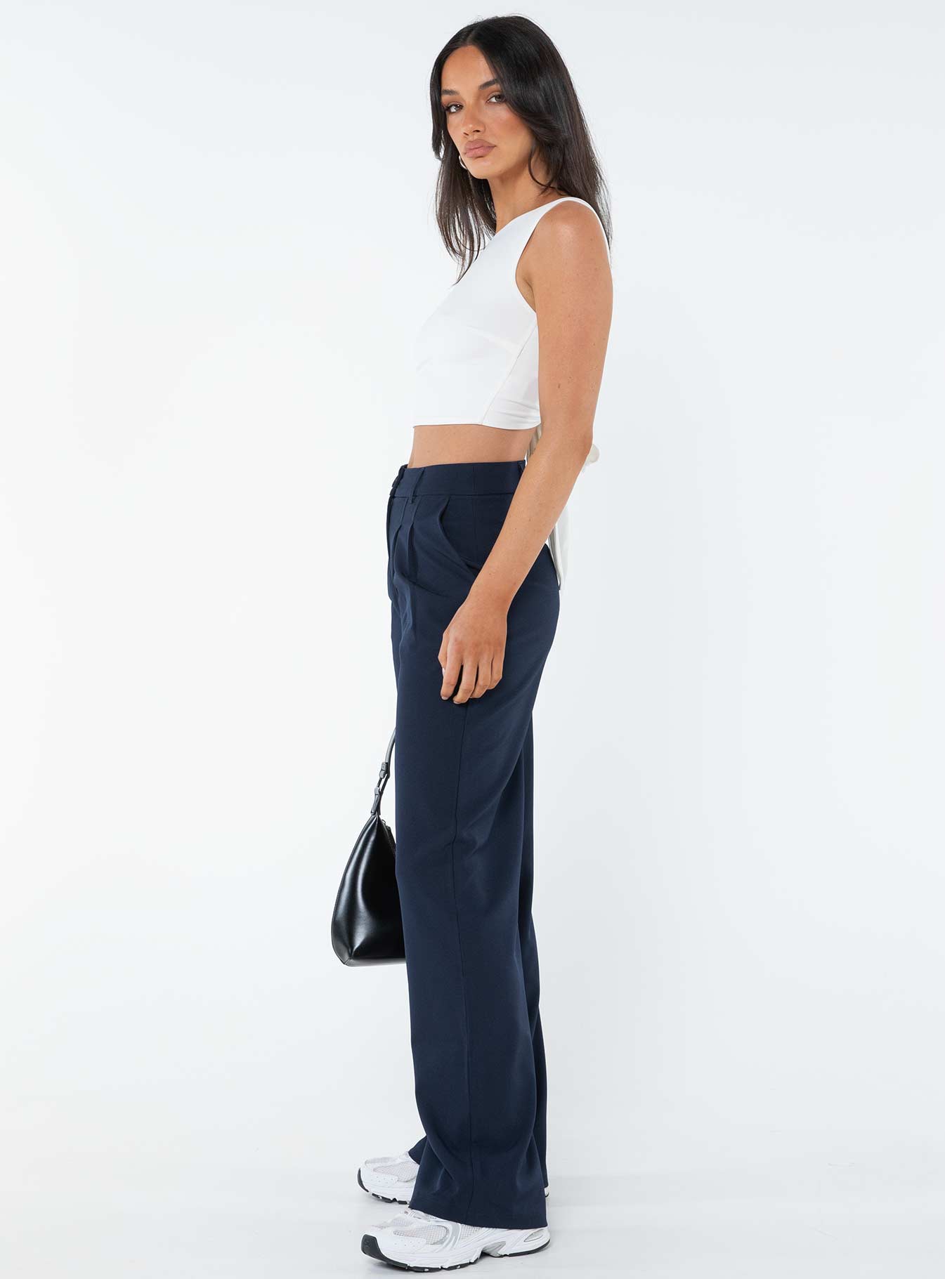 Tailored pants Front button and zip fastening, belt looped waist, subtle pleats at waist, twin hip pockets