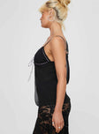 Top Open front style, sheer material, lace trim detail, ribbon detail as tie fastening at bust, adjustable shoulder straps