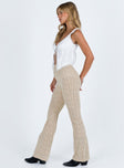 Cream pants Sheer knit material Elasticated waistband Straight leg Slightly flared cuff Good stretch